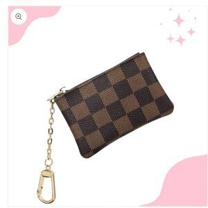 Checker coin/keychain wallet.  NWOT. I have five available.  Great gifts